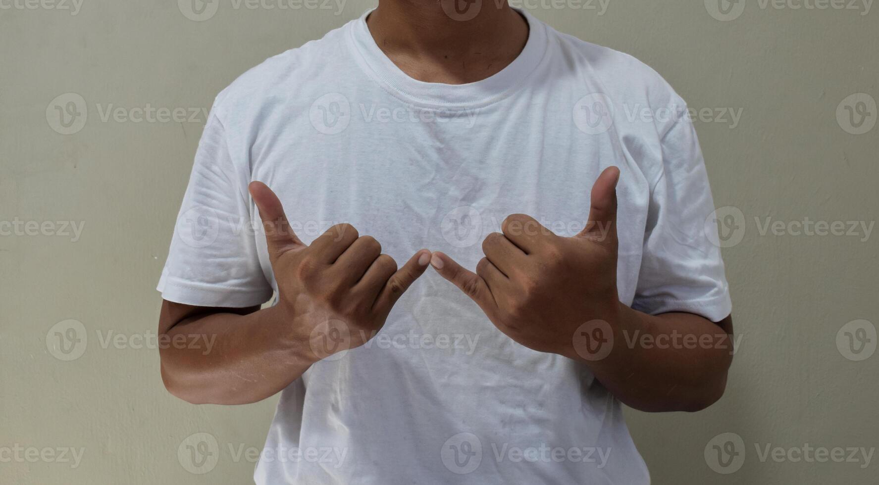 Young man learning and communicating in american sign language photo