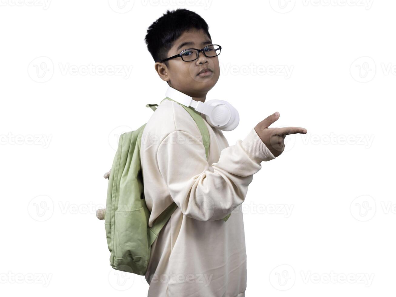 Portrait of boy in casual clothes carry a green bag and white headphones isolated on a white background, The concept of education and way of life. Cute boy posing in casual clothes with clipping part. photo