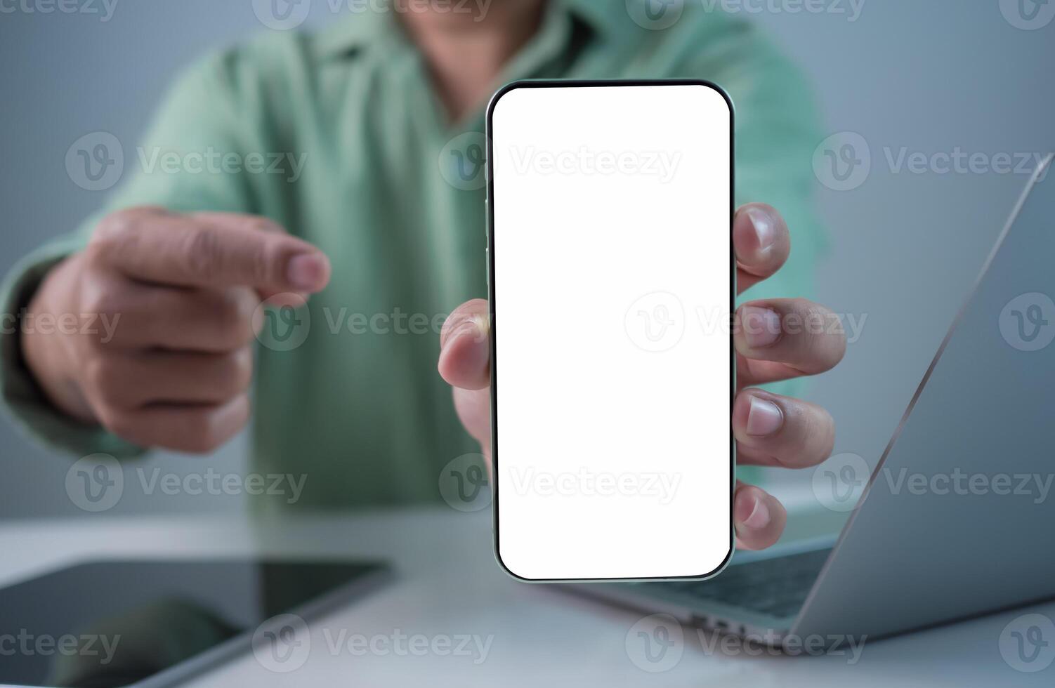Businessman hand holding smartphone with white empty screen in hand, Smartphone mockup for online shopping, Booking and banking concept, Online education or online business with copy space. photo