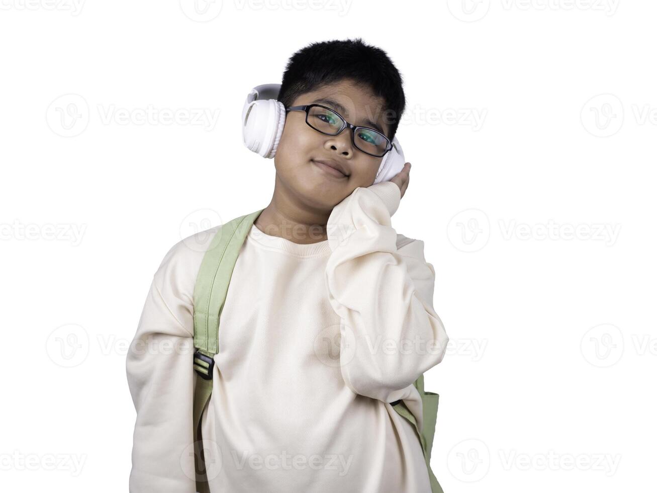 Portrait of boy in casual clothes carry a green bag and white headphones isolated on a white background, The concept of education and way of life. Cute boy posing in casual clothes with clipping part. photo