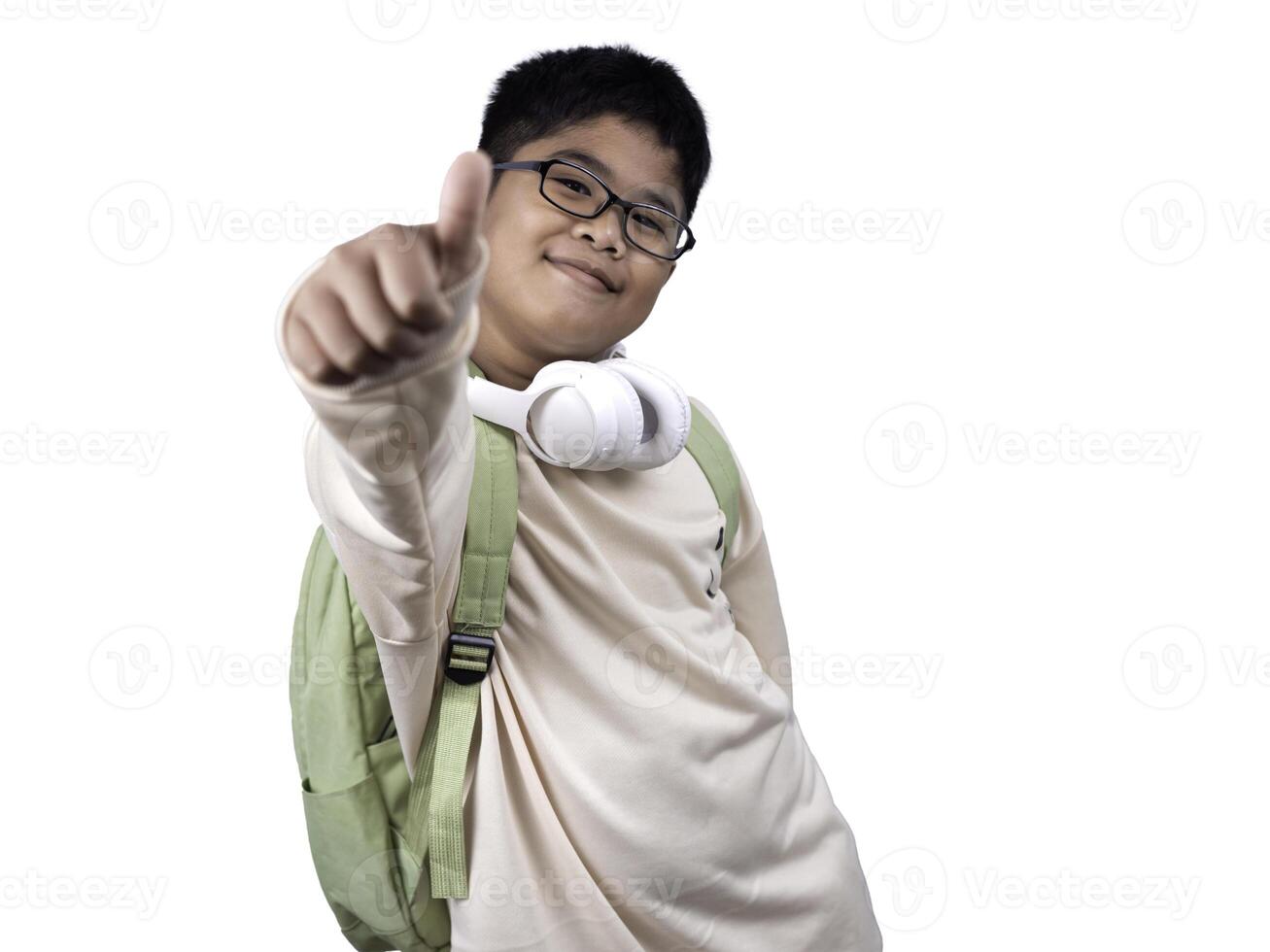 Portrait of boy in casual clothes carry a green bag and white headphones isolated on a white background, The concept of education and way of life. Cute boy posing in casual clothes with clipping part. photo