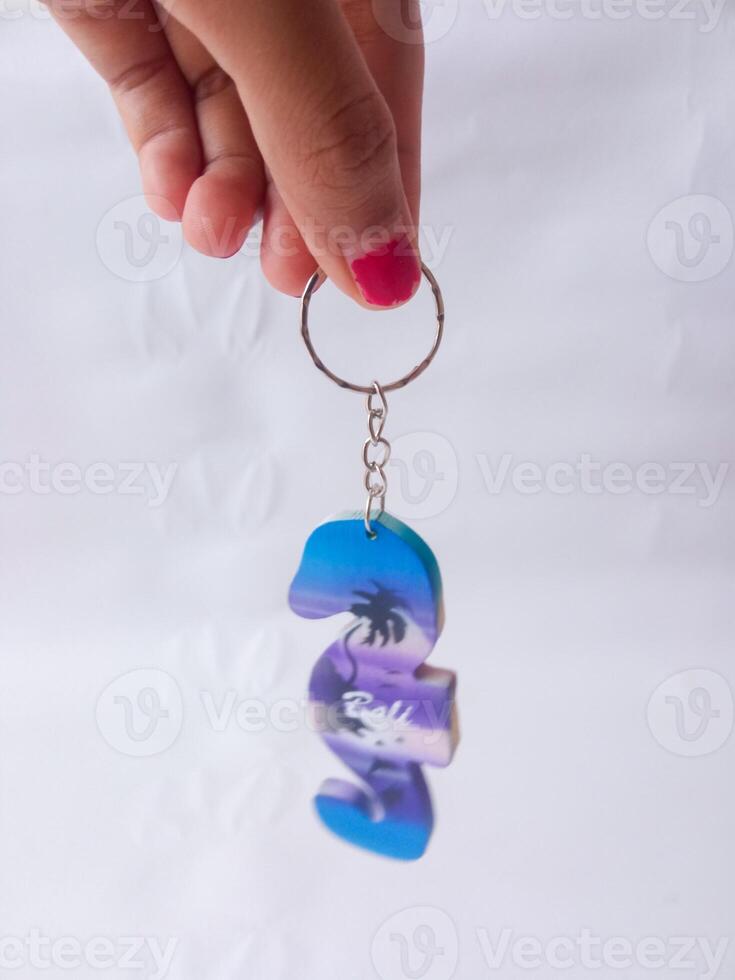 Bali keychain. souvenirs from Bali. isolate on white photo