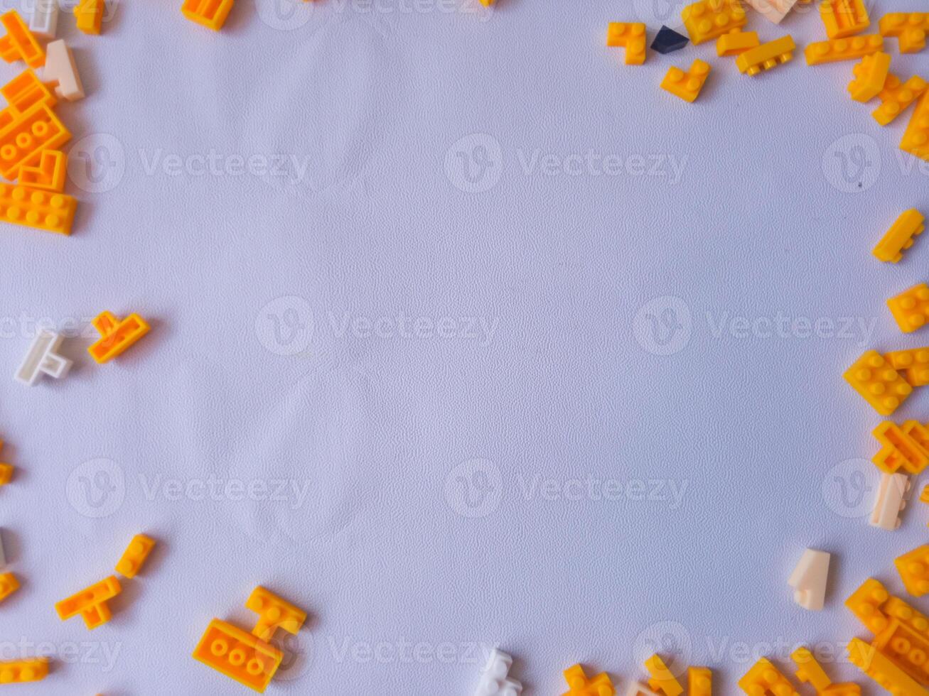 Colorful Plastic Yellow Toy Bricks Background photo