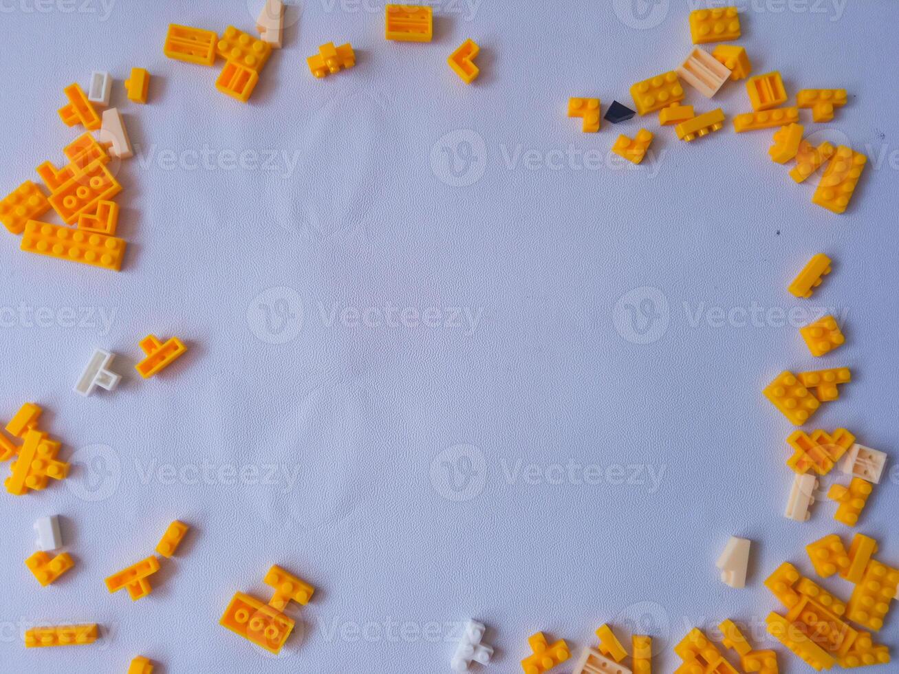 Colorful Plastic Yellow Toy Bricks Background photo