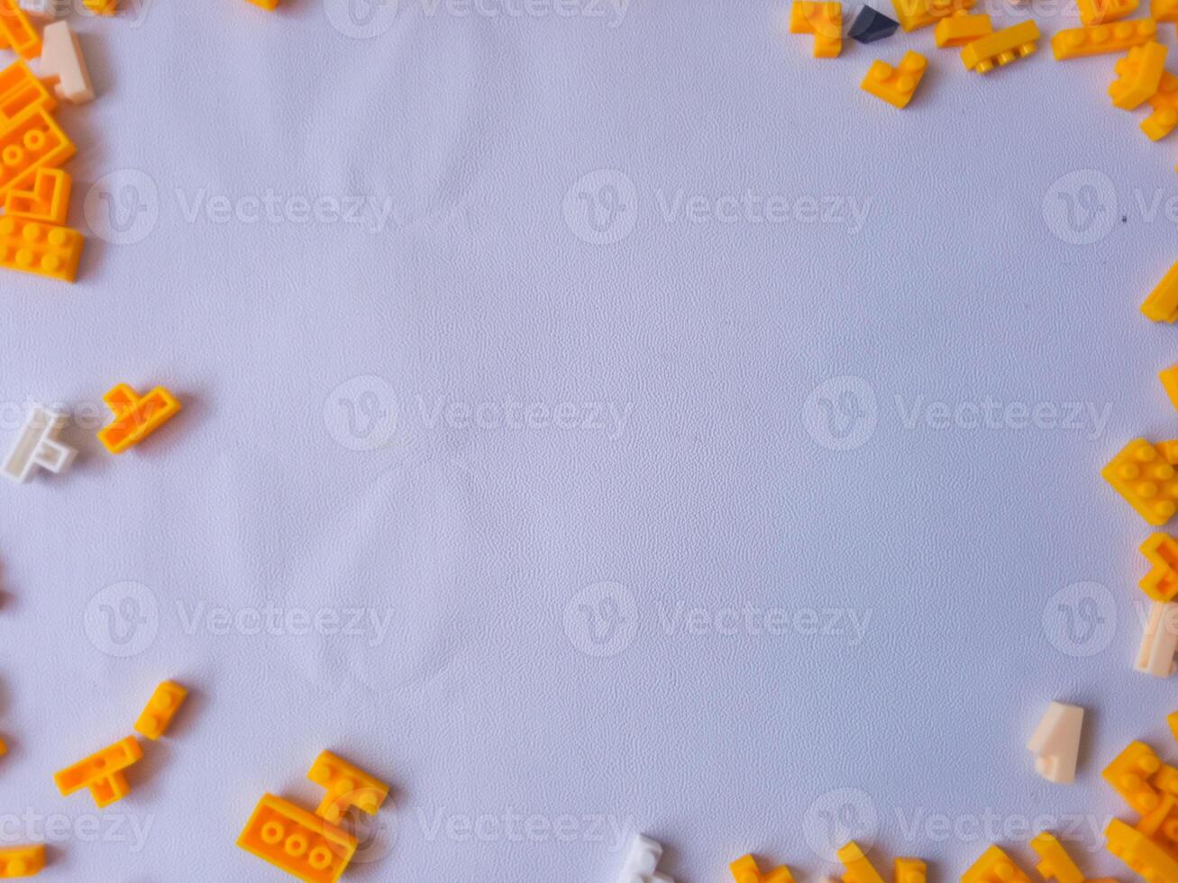 Colorful Plastic Yellow Toy Bricks Background photo