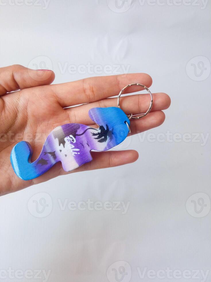 Bali keychain. souvenirs from Bali. isolate on white photo