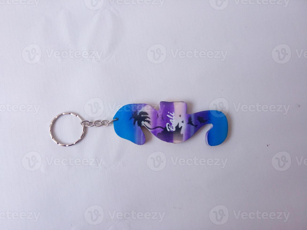 Bali keychain. souvenirs from Bali. isolate on white photo