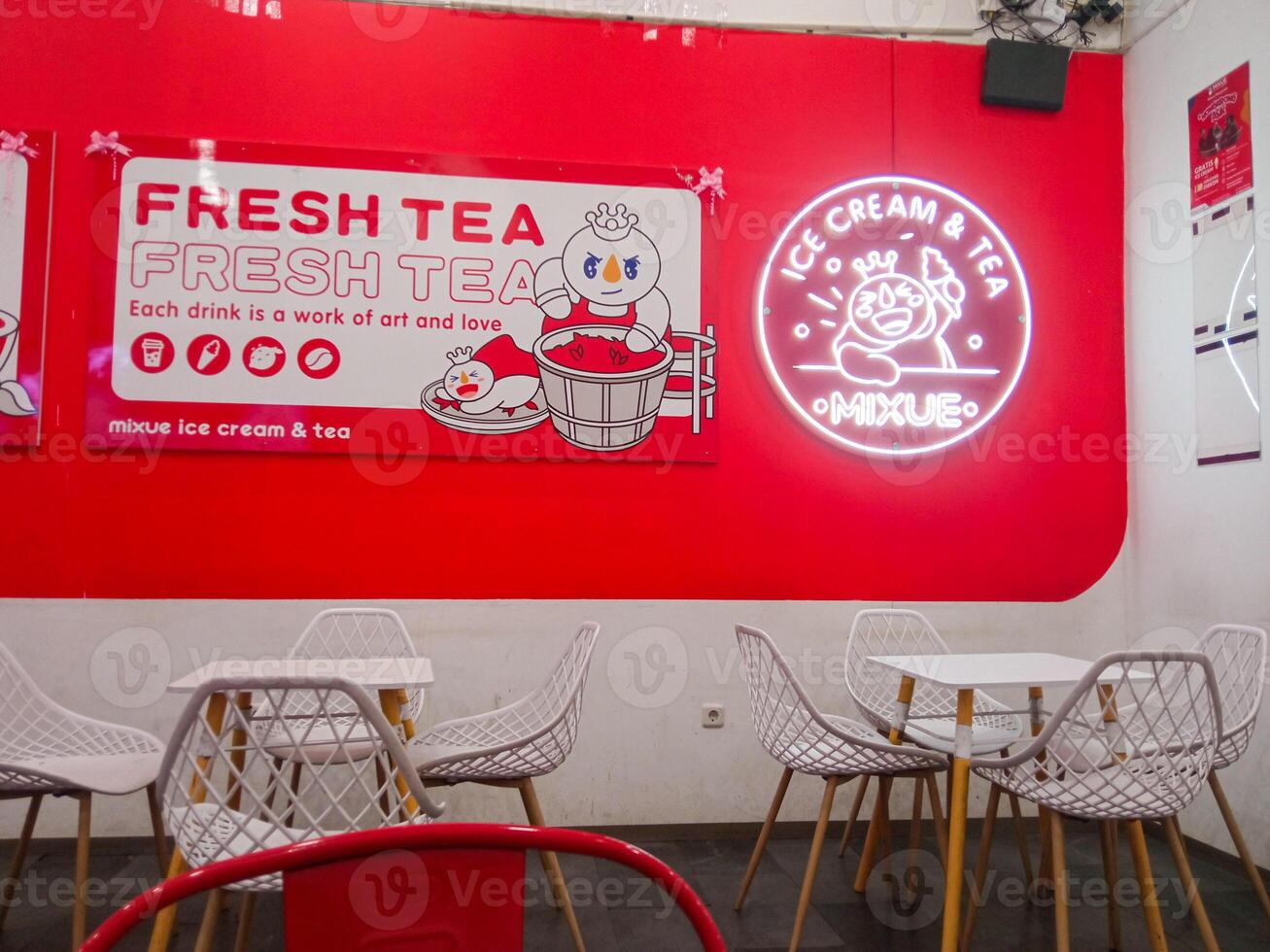 Surabaya, Indonesia - September 24, 2024 Mixue Ice Cream Tea is a chain of ice cream and tea stores that launched a new brand image, Snow King as its brand icon. photo