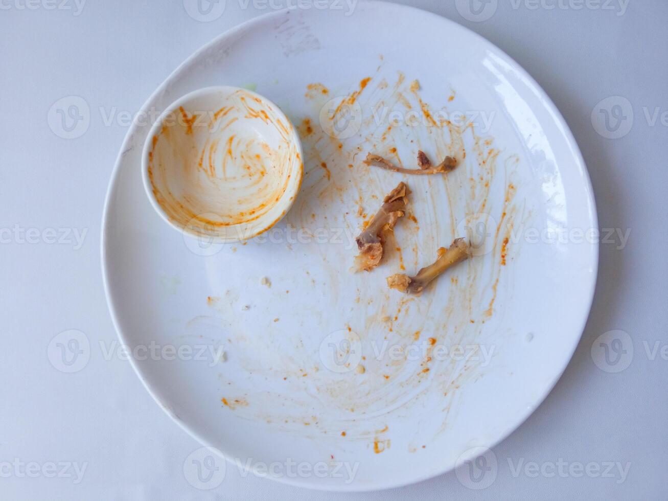 dirty plates used for eating isolate on white photo
