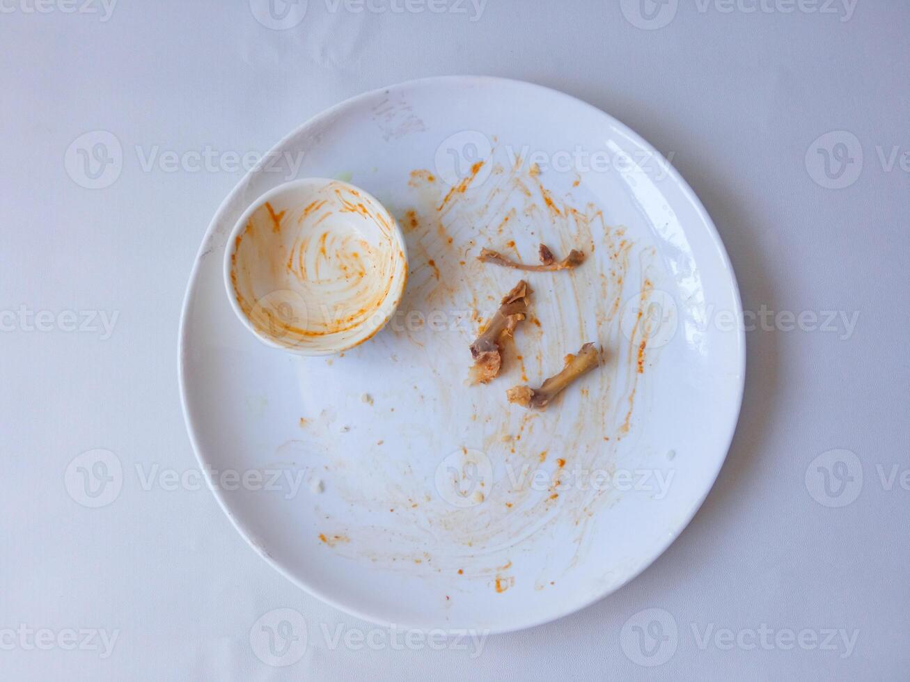 dirty plates used for eating isolate on white photo