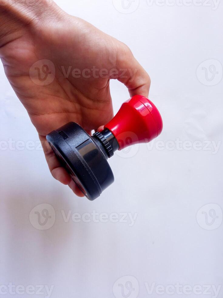 Asian female hand holding Flash stamp on a white background photo