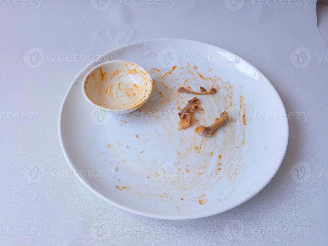 dirty plates used for eating isolate on white photo