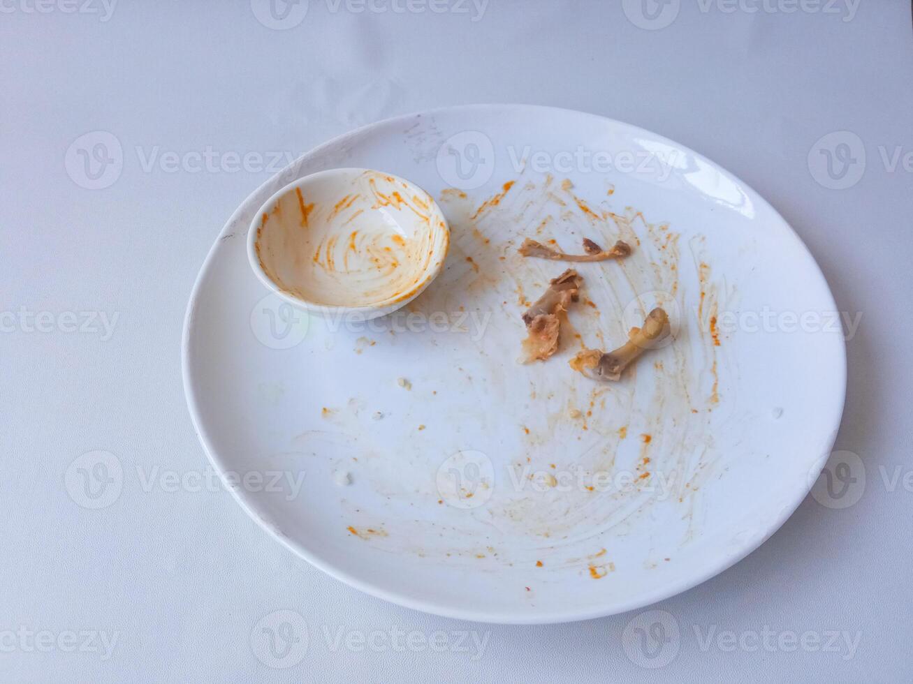 dirty plates used for eating isolate on white photo