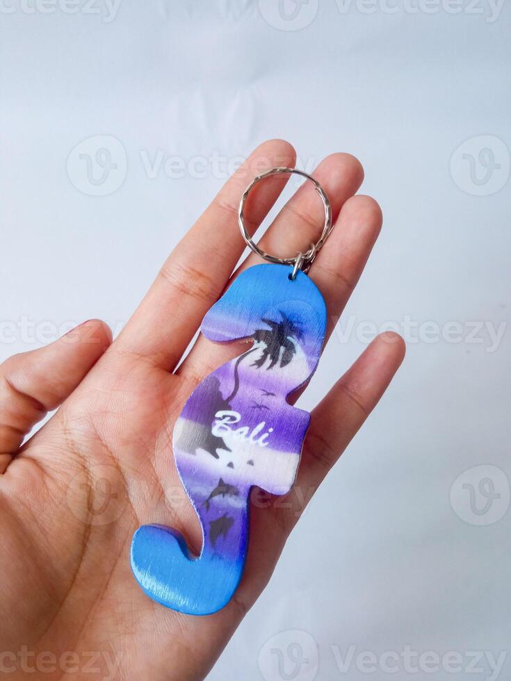 Bali keychain. souvenirs from Bali. isolate on white photo
