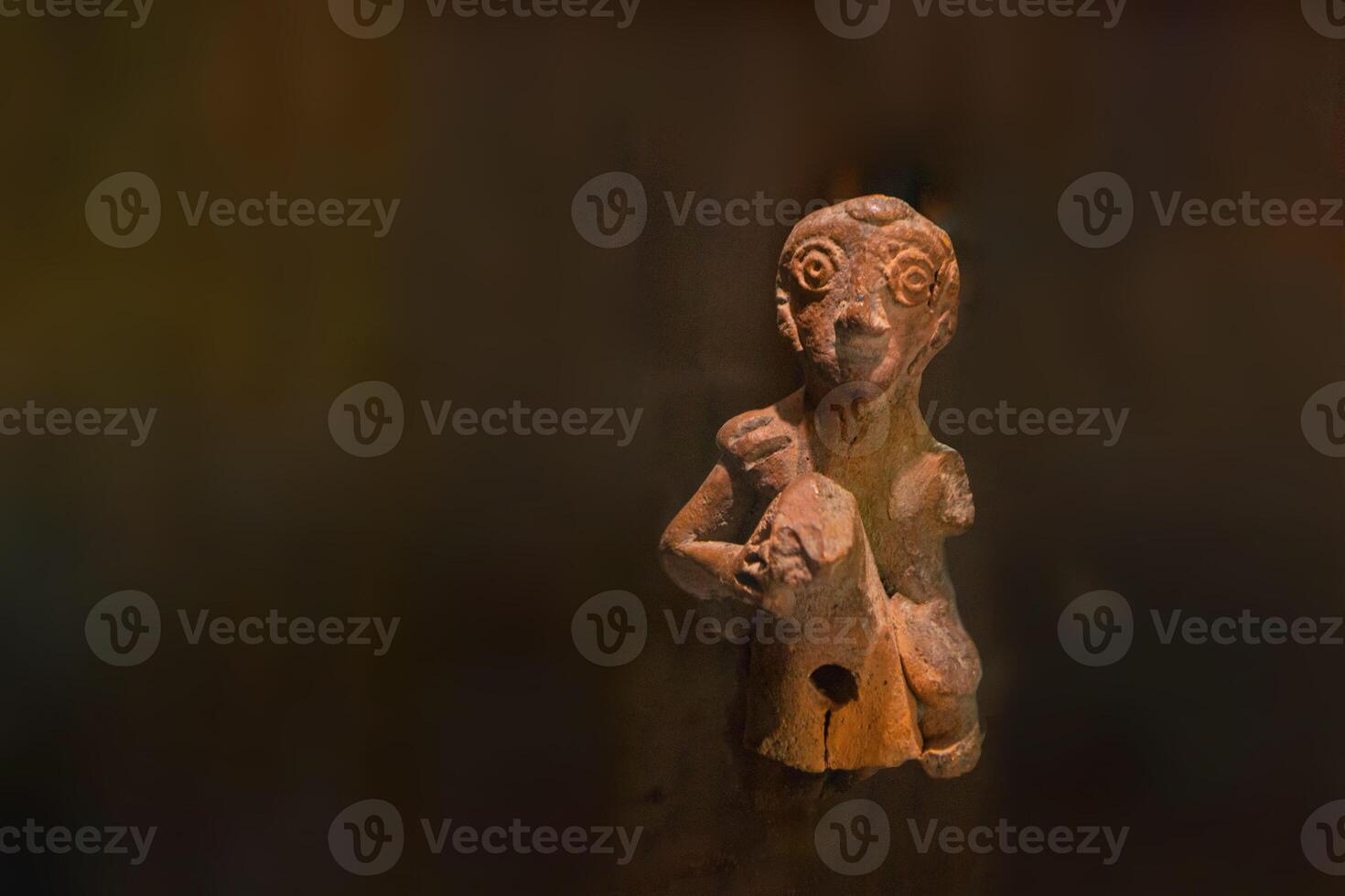 Prehispanic clay figurines of ancient people photo