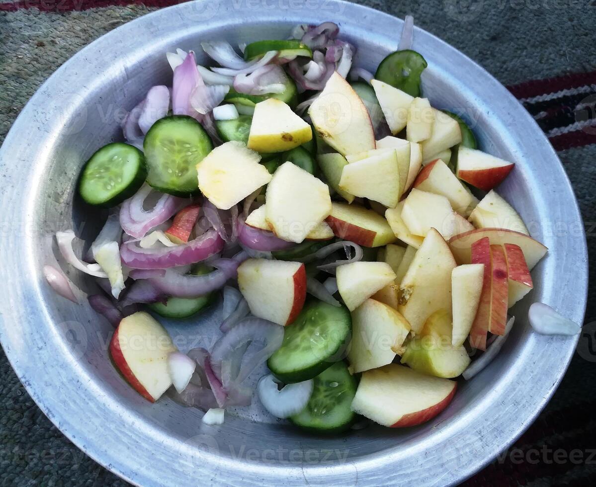 A vibrant mix of salads and fruits offers a refreshing burst of flavor and nutrition. Crisp greens, colorful veggies, and juicy fruits create a delicious and healthy option for any meal. Enjoy it. photo