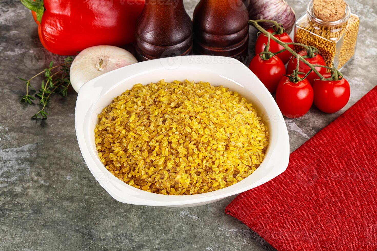 Dry wheat bulgur cereal heap photo