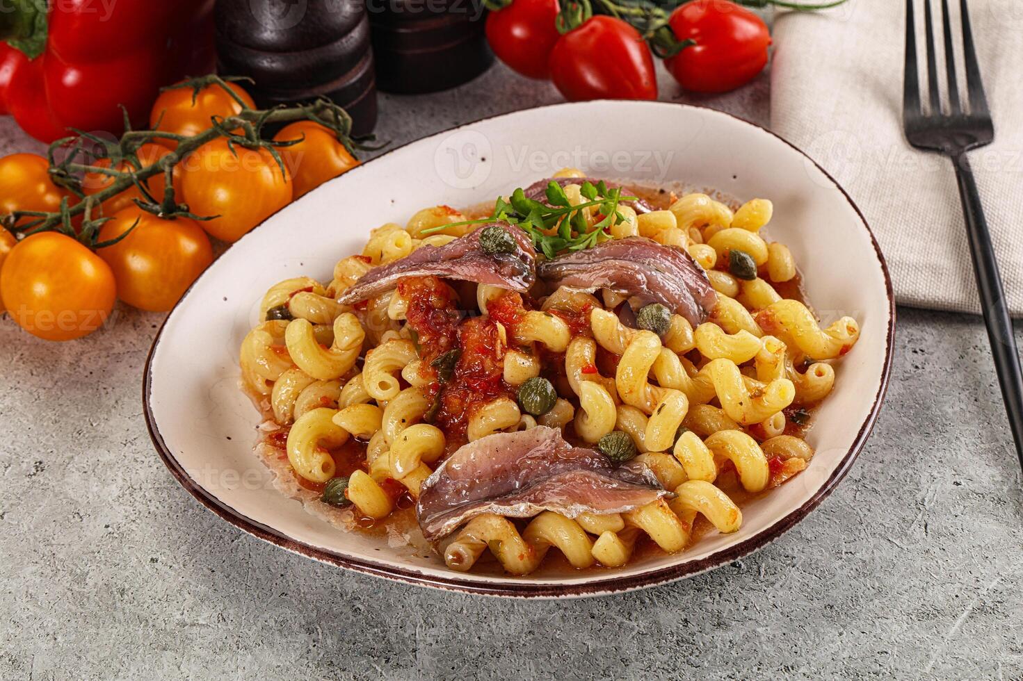 Italian pasta cellentani with anchovy photo