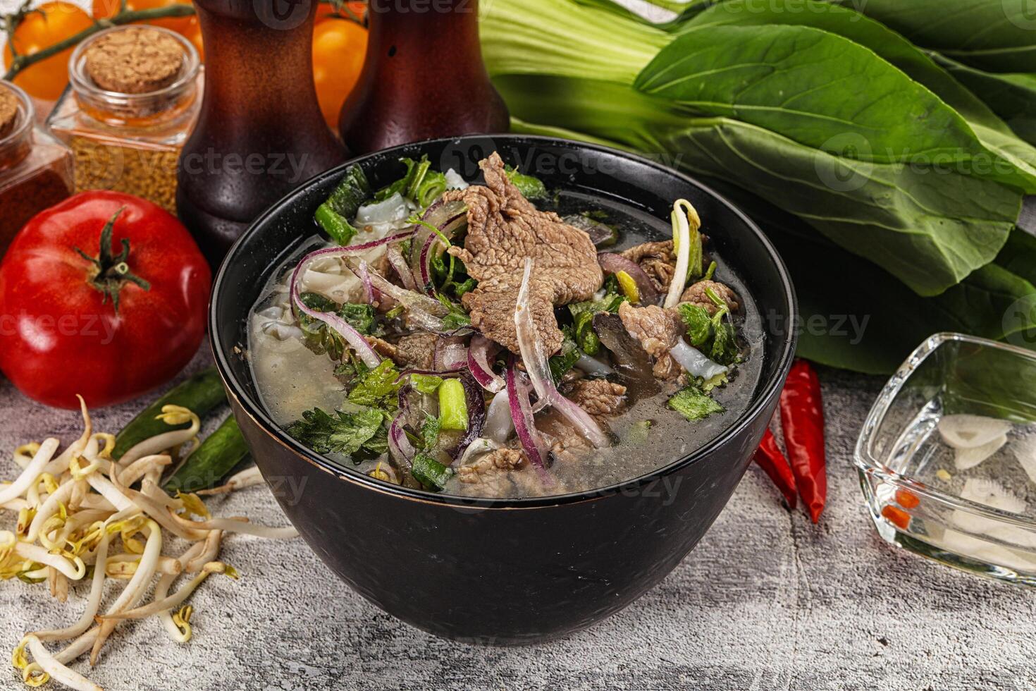 Vietnamese cuisine - Pho Bo soup with beef photo