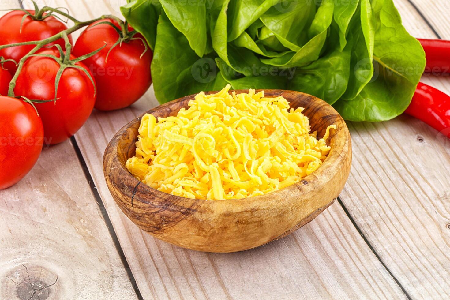 Shredded cheese in the bowl photo