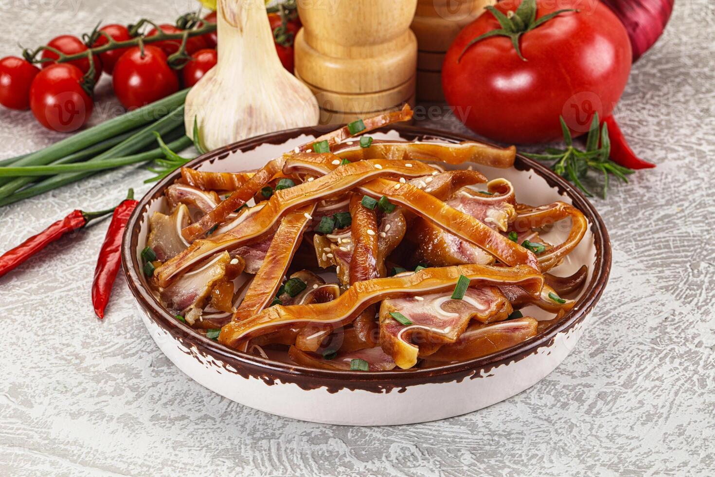 Sliced smoked pork ear snack photo
