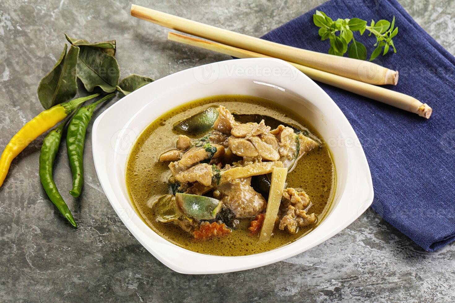 Thai green curry soup with basil photo