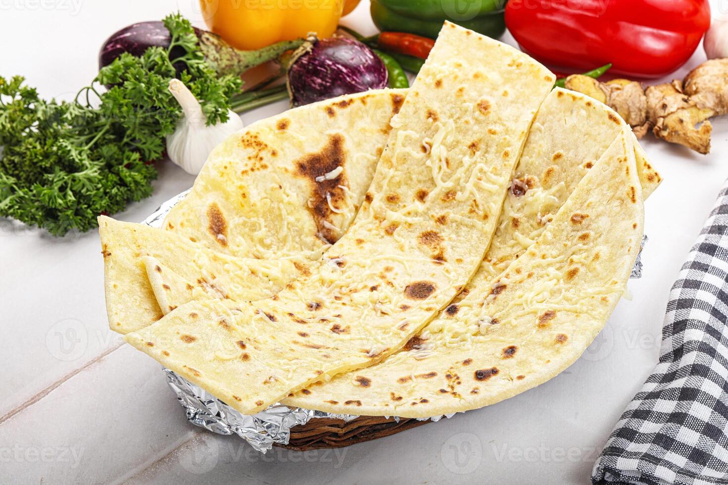 Indian bread cheese garlic naan photo