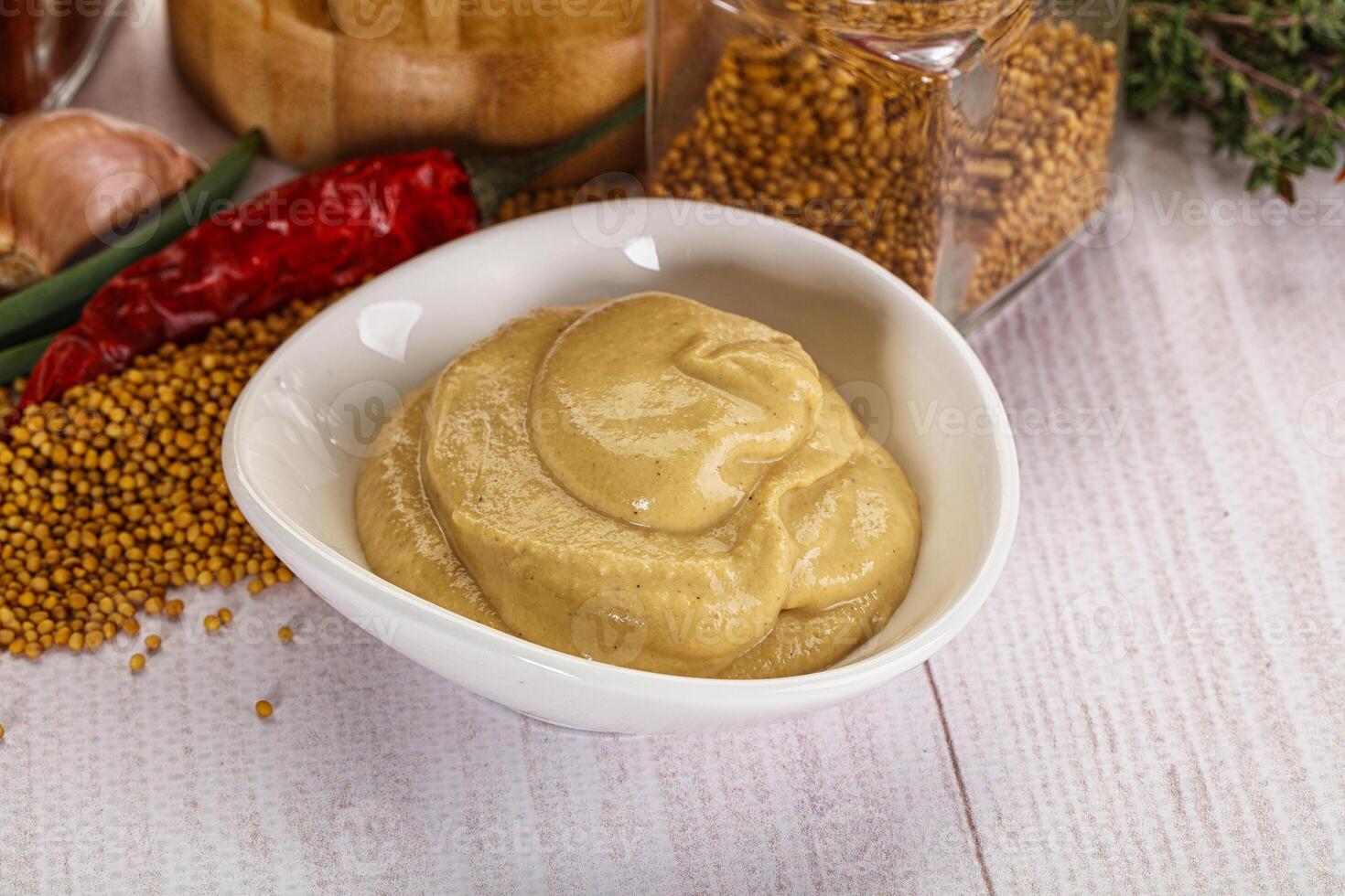 Dijon mustard sauce in the bowl photo