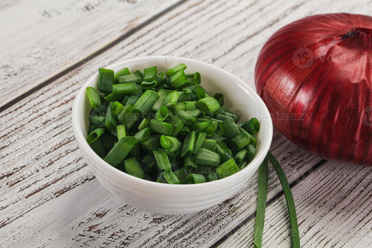 Diced green onion in the bowl photo