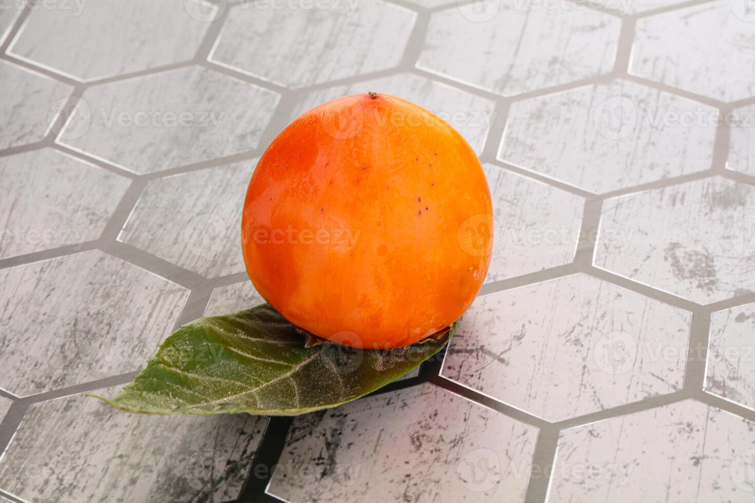 Fresh ripe sweet juicy persimmon photo