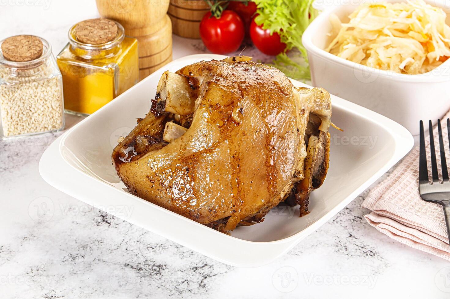 Baked pork knee with spices photo