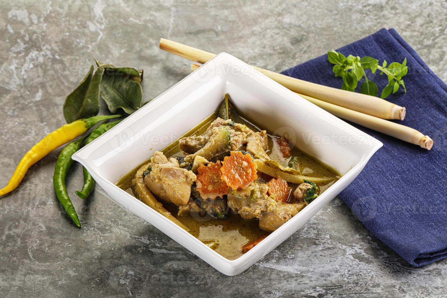 Thai green curry soup with basil photo