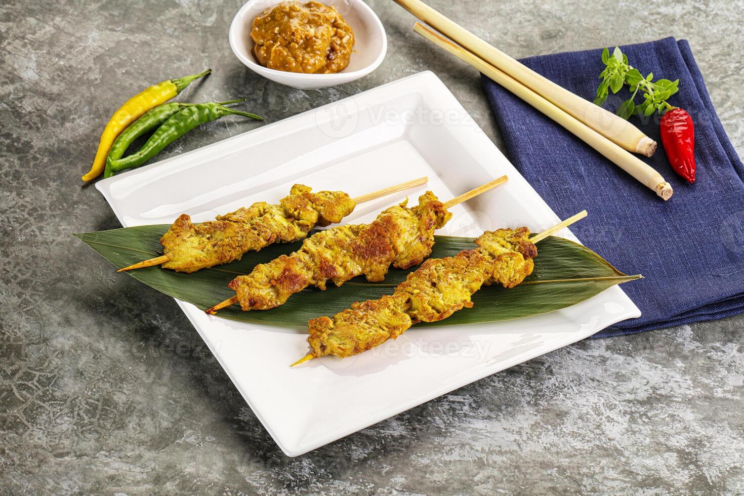 Thai meat skewer Satay with sauce photo