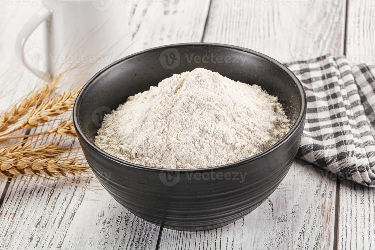 Wheat flour heap for bake photo