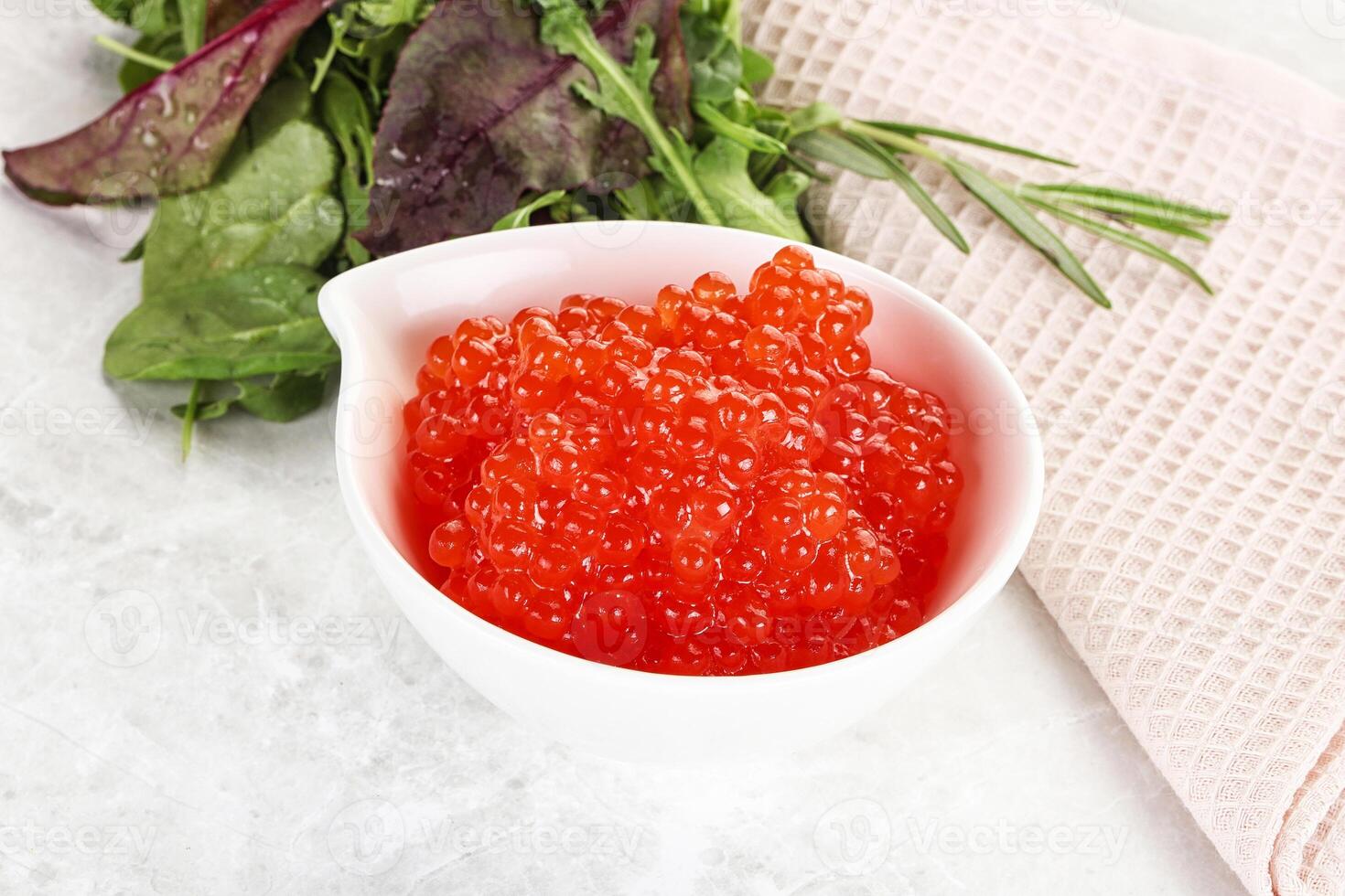 Red caviar in the bowl photo