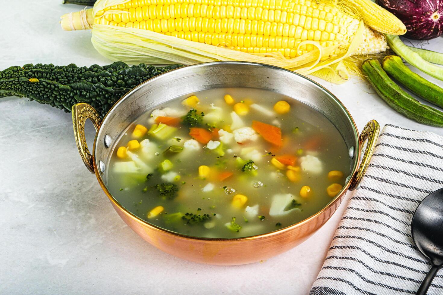 Soup with corn and broccoli photo