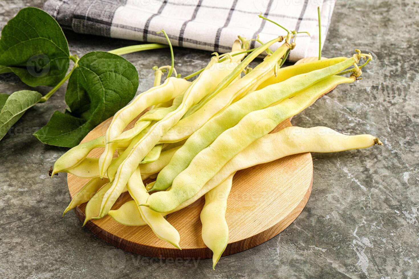Raw green bean strings heap photo