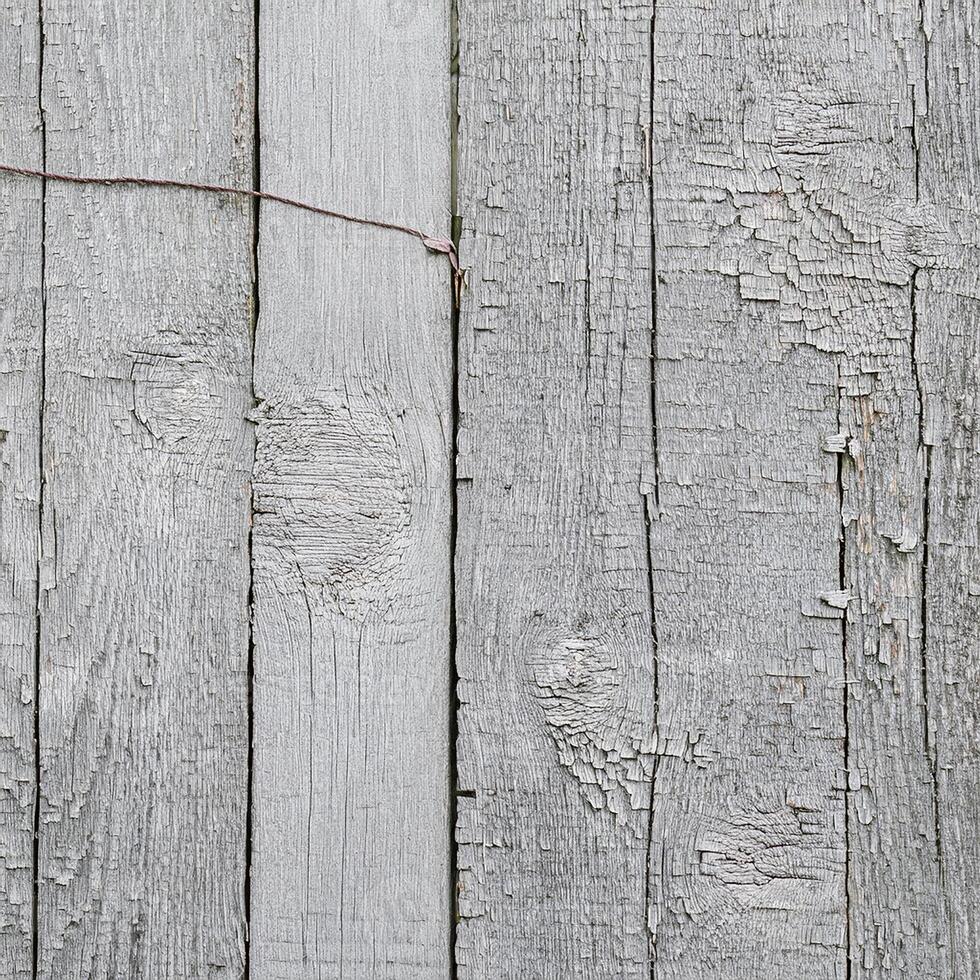 A close up of a wooden fence with a wooden fence post photo