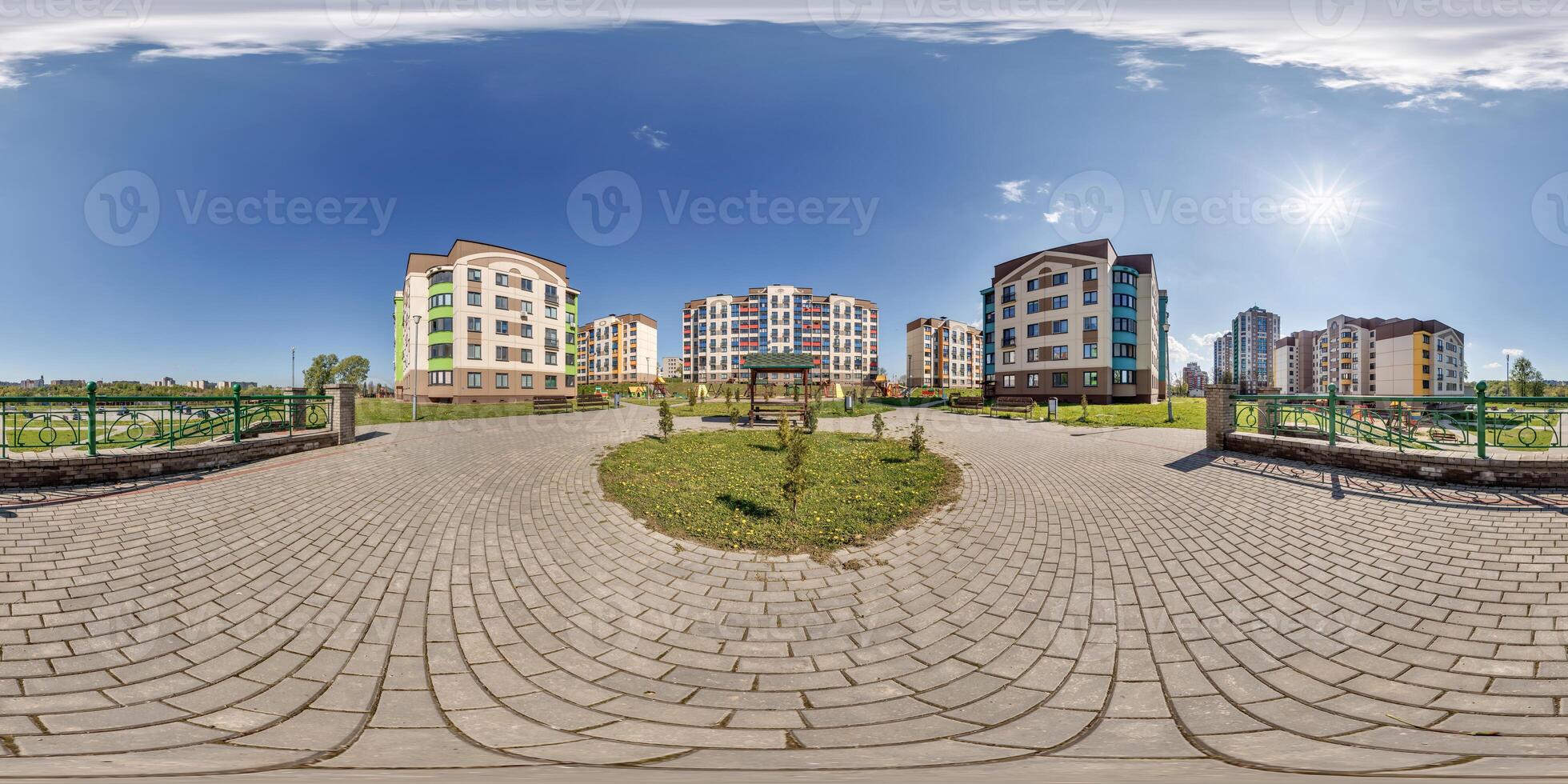360 hdri panorama in middle of modern multi-storey multi-apartment residential complex of urban development in equirectangular seamless spherical projection, AR VR content photo