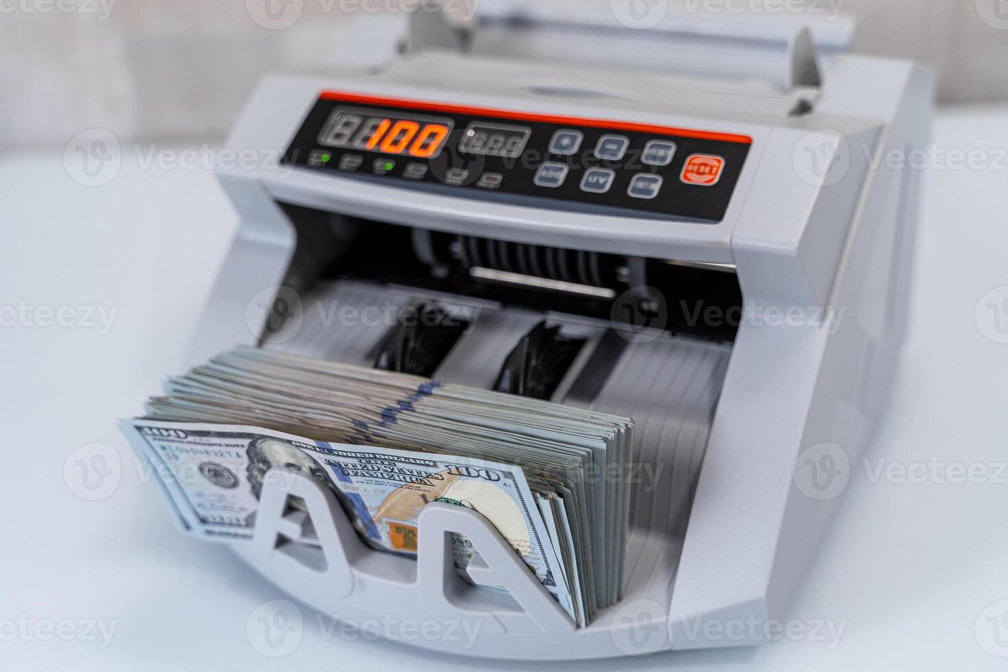 Cropped view of the banking modern counter. Money counting on special machine. Money and business concept photo