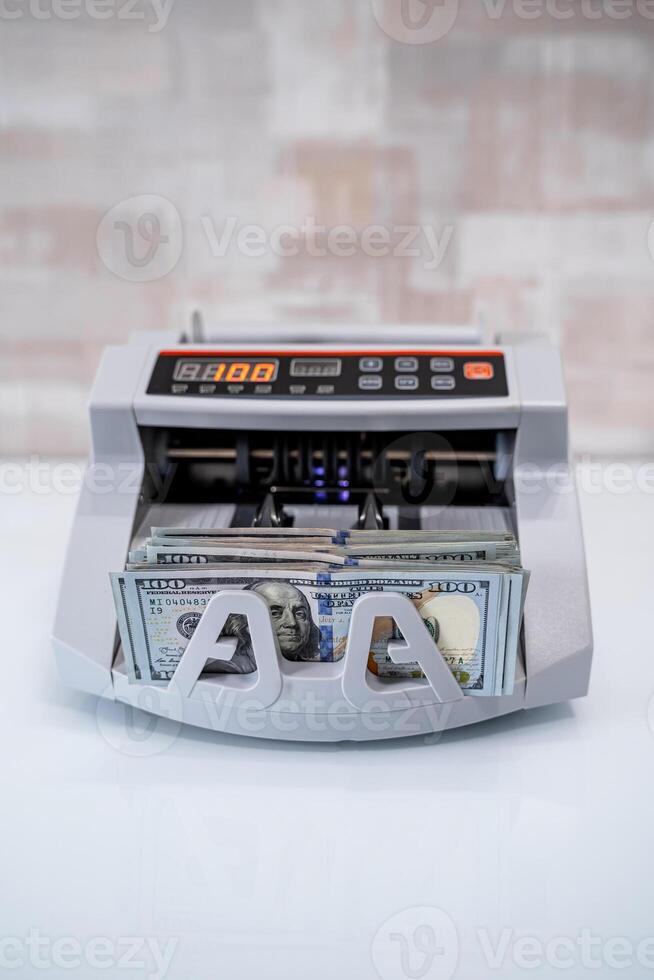 Bank cash counter machine. Vertical view of the finance business money counting. Money and business concept photo