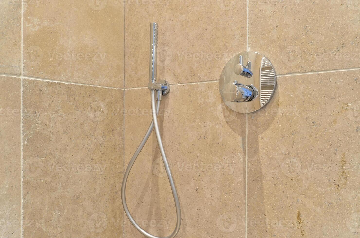 A shower head with a hose attached to it photo