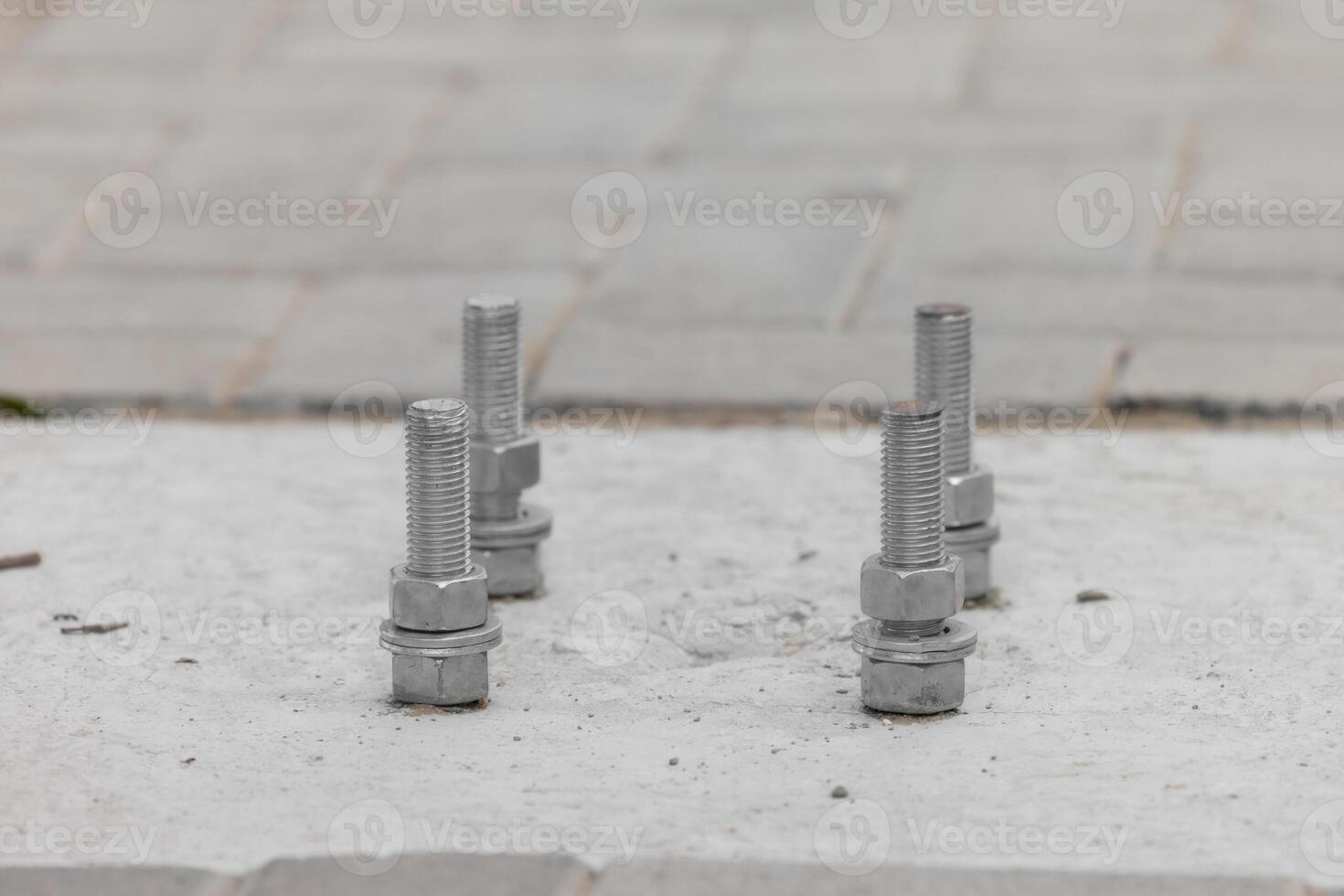 Anchorage bolt and nut which embedded in concrete structure etail of bolts. photo