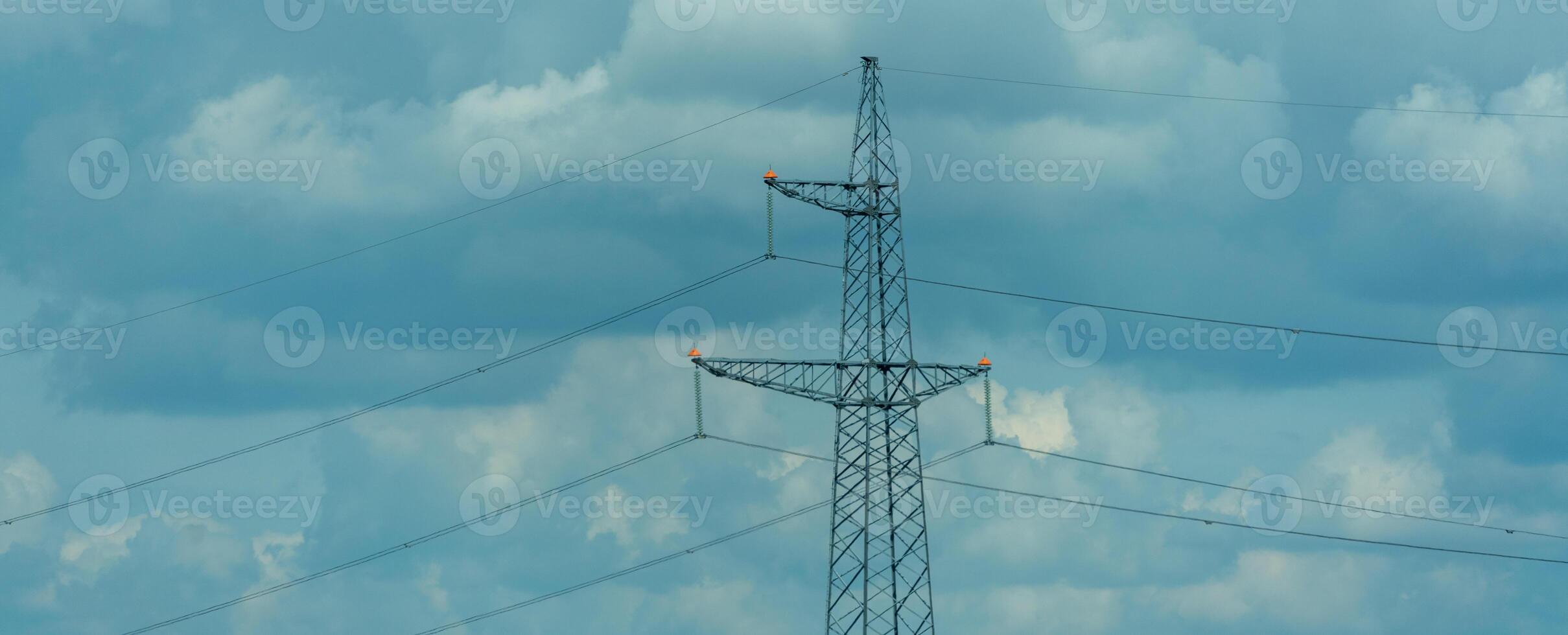 High voltage towers with sky background. Power line support with wires for electricity transmission. High voltage grid tower with wire cable at distribution station. Energy industry, energy saving photo
