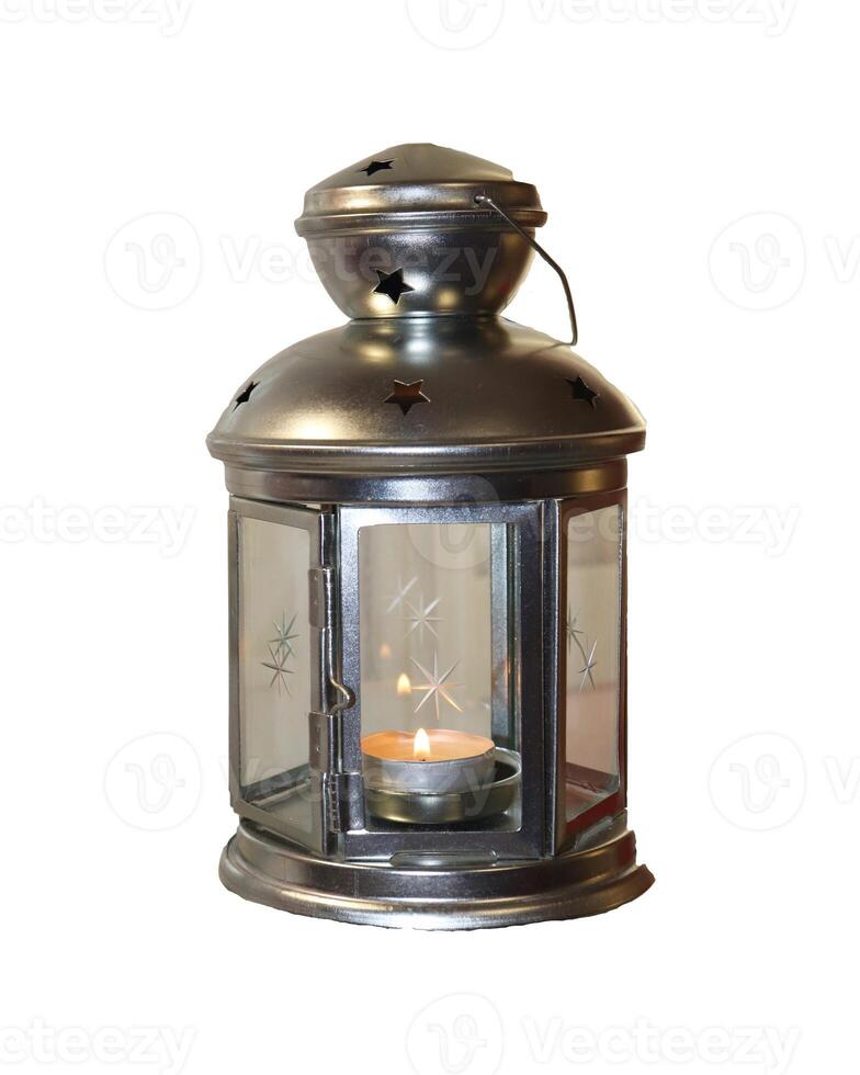 Metal candlestick with glass doors with a burning candle inside - color photo, isolate for design photo