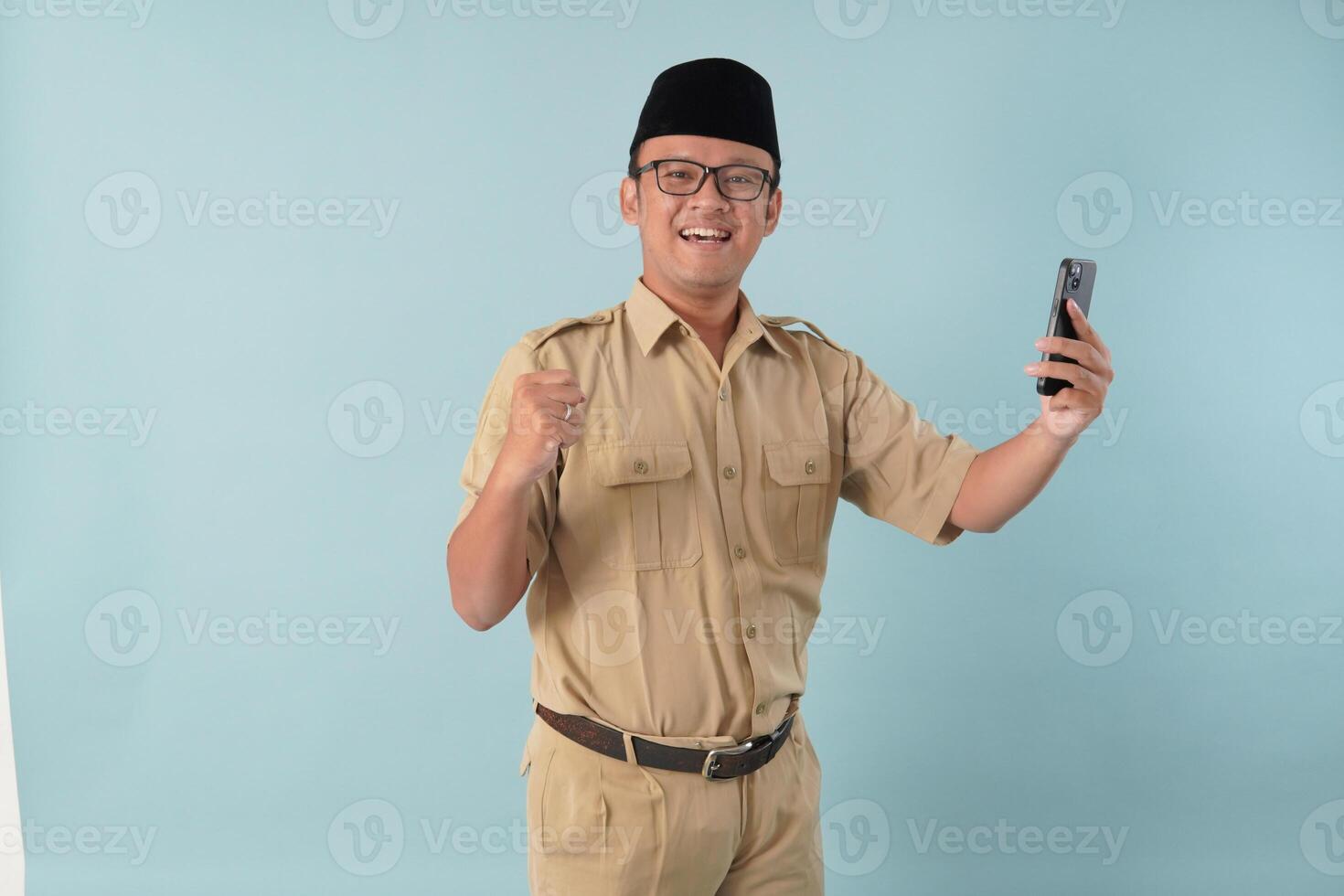 Indonesian government worker man doing call with a happy successful expression. photo
