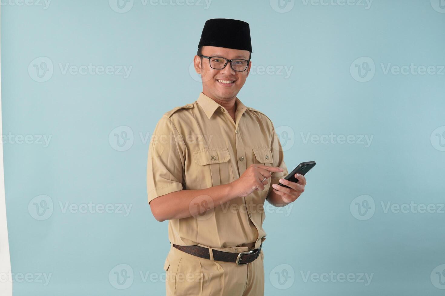 Handsome government worker man wearing khaki uniform holding smartphone while smiling. photo