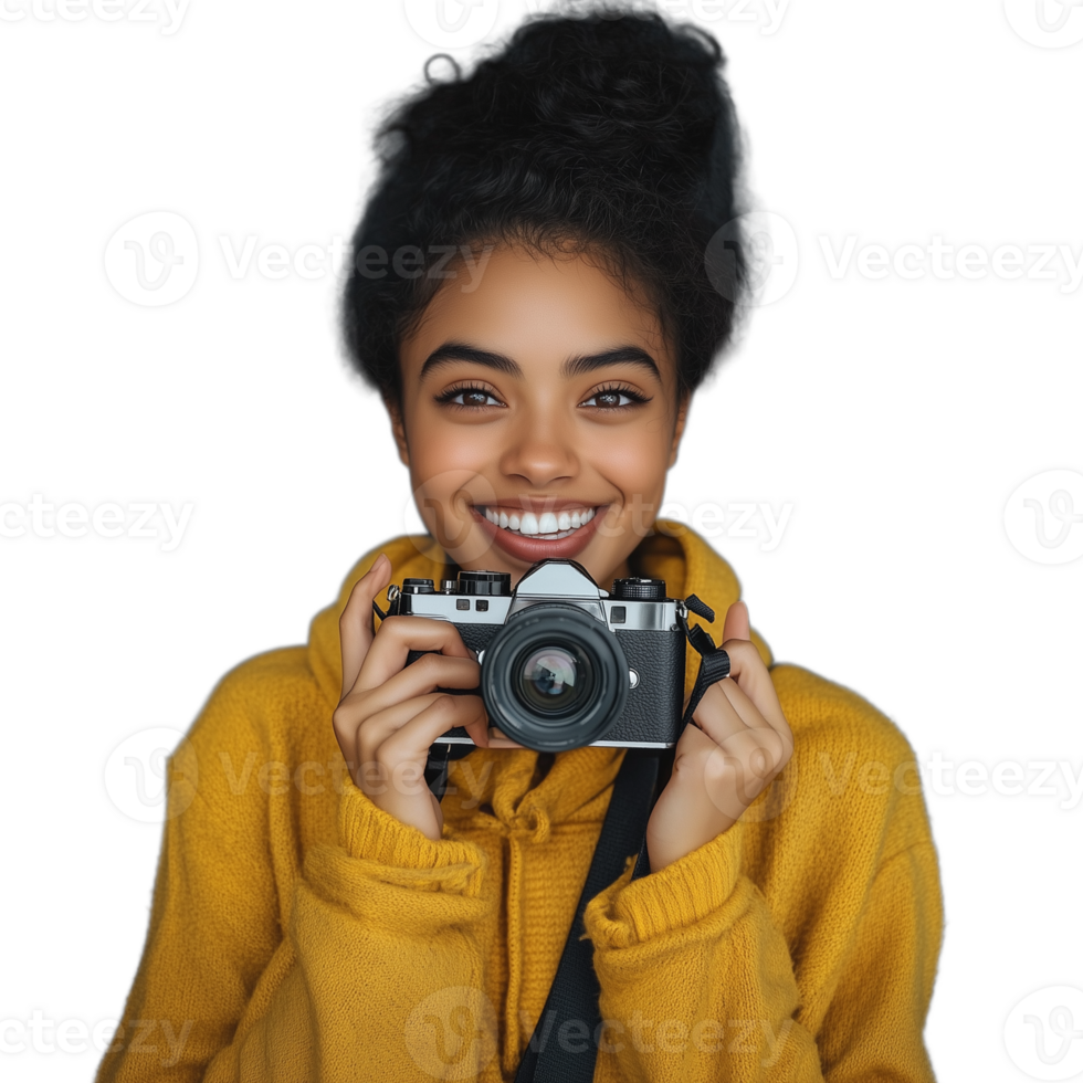 Cheerful young woman holding a camera, wearing a yellow sweater, isolated against a transparent background png