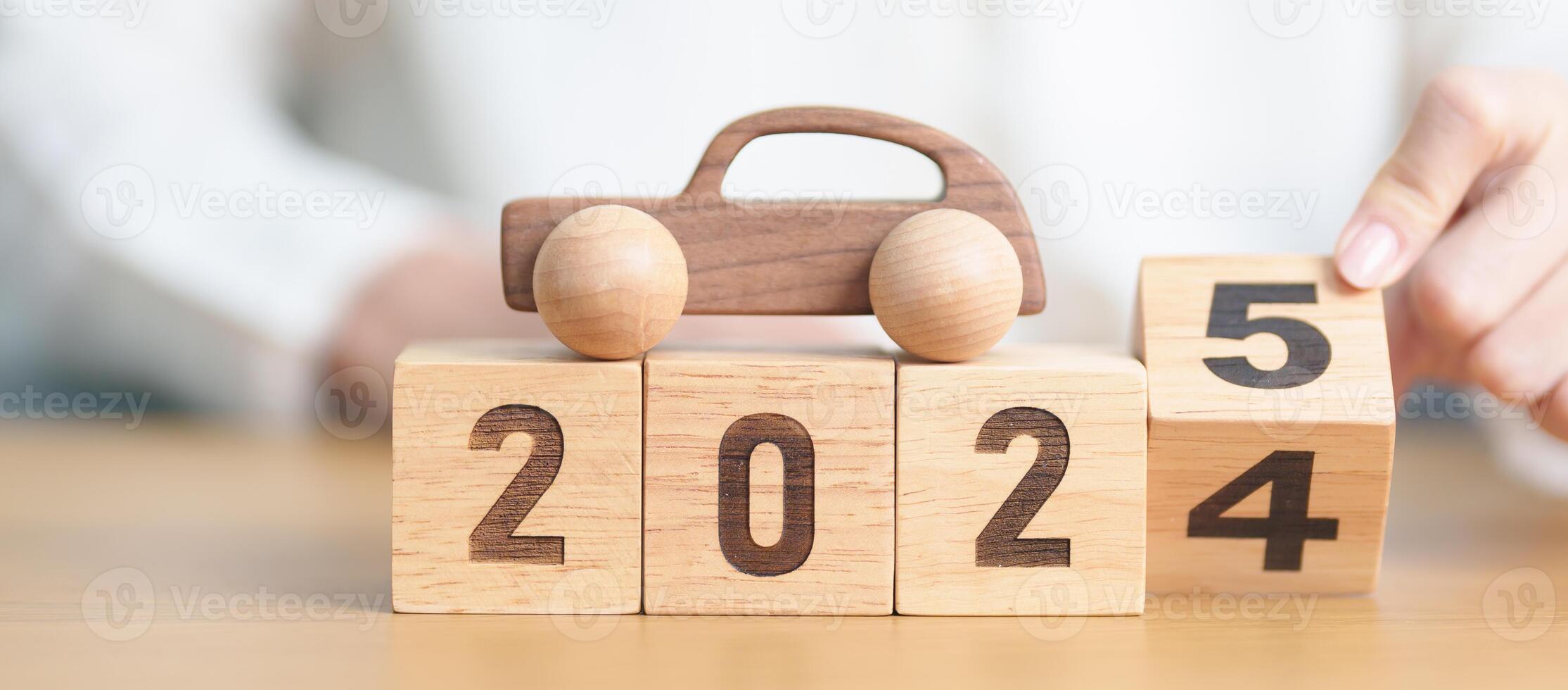 2024 end year to Happy New Year 2025 with Car model on table. Automobile Tax, Car Insurance, Financial, vehicle Repair and Maintenance and New Year concept photo