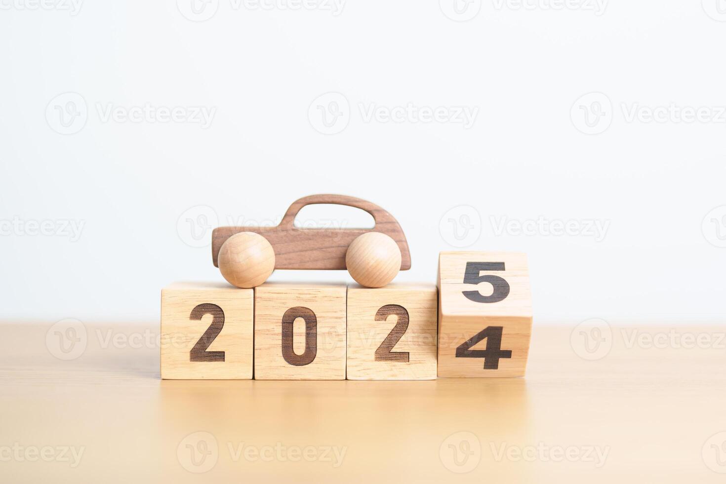 2024 end year to Happy New Year 2025 with Car model on table. Automobile Tax, Car Insurance, Financial, vehicle Repair and Maintenance and New Year concept photo